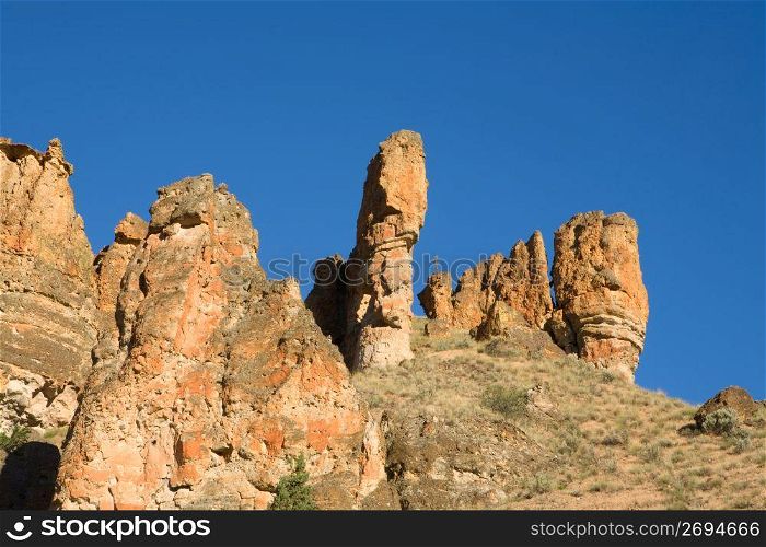 Rugged cliffs of rock formations and spire in remote area
