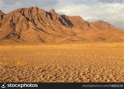 Rugged mountain landscape with cloudy sky, Namib desert, Namibia