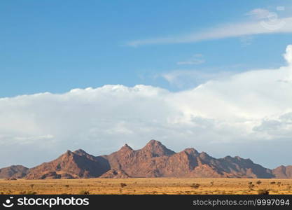 Rugged mountain landscape with cloudy sky, Namib desert, Namibia 