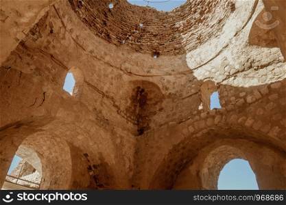 Ruin and ancient inside the dome of Sarvestan Palace, Sassanid-era building. The building made of baked brick, stone and mortar. Sarvestan, Fars province, Iran.