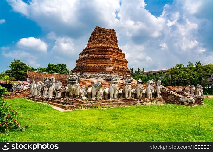 Ruin bell-shaped chedi surrounded by lions at Wat Thammikarat buddhist temple in Phra Nakhon Si Ayutthaya Province Thailand