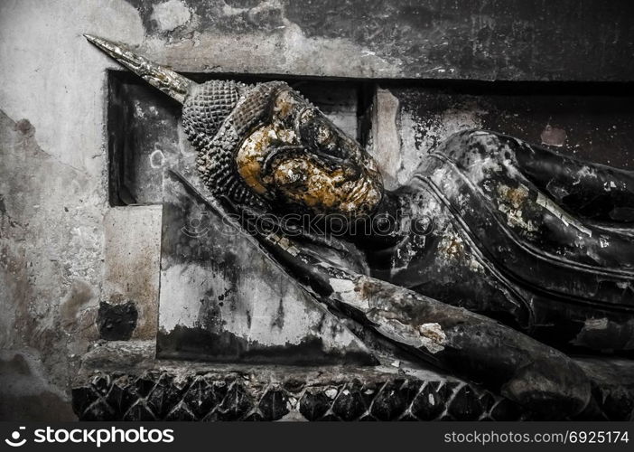 Ruin of Ayutthaya Buddha sculpture at Putthaisawan Temple