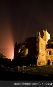 ruin of Melrose Abbey illuminated at night