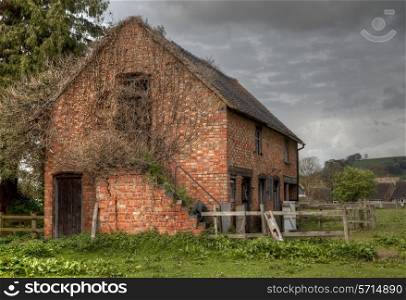 Ruined brick stable, Mickleton, Gloucestershire, England.
