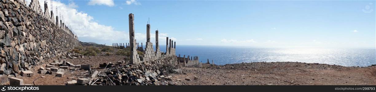 Ruined fence on the coast of La Gomera island, Spain