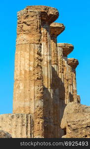 Ruined Temple of Heracles columns in famous ancient Valley of Temples, Agrigento, Sicily, Italy. UNESCO World Heritage Site.