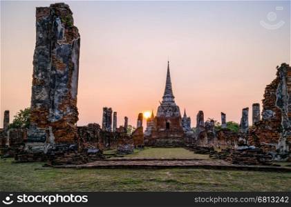Ruins and pagoda ancient architecture of Wat Phra Si Sanphet old temple famous attractions during sunset at Phra Nakhon Si Ayutthaya Historical Park in Ayutthaya Province, Thailand