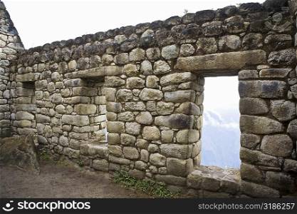 Ruins of a stone wall, Aguas Calientes, Mt Huayna Picchu, Machu Picchu, Cusco Region, Peru