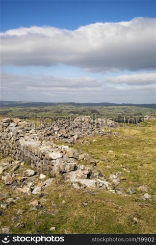 Ruins of abandoned copper mines in landscape in Peak District in Uk