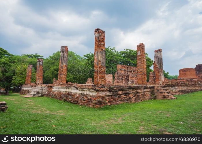 Ruins of buddha statues and pagoda of Wat Mahathat temple in Ayutthaya historical park, Thailand