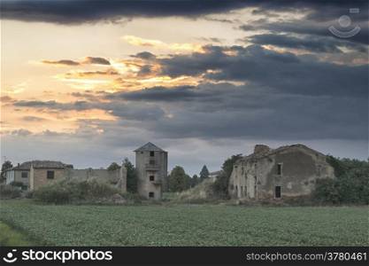 Ruins of old farmer homes and barns in Italian countryside during spring