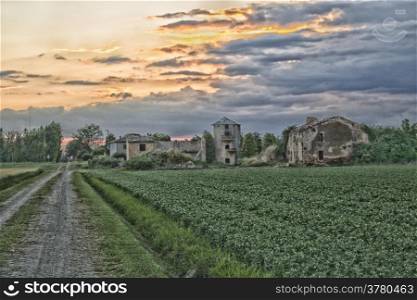 Ruins of old farmer homes and barns in Italian countryside during spring