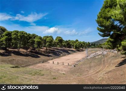 Ruins of olympic stadium in Epidavros, Greece in a summer day