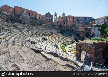 Ruins of the ancient Greek Roman theatre in the historic centre of Catania, Sicily , Italy