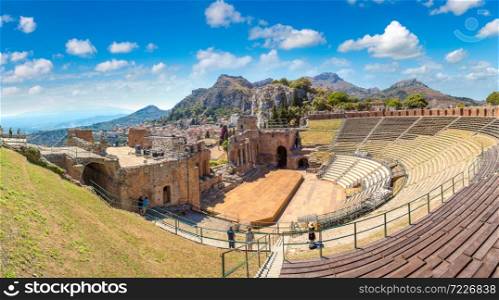 Ruins of the ancient Greek theater in Taormina, Sicily, Italy in a beautiful summer day