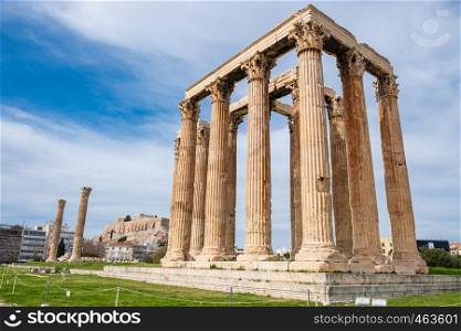 Ruins of the ancient Temple of Olympian Zeus in Athens (Olympieion or Columns of the Olympian Zeus) with Acropolis hill in the background