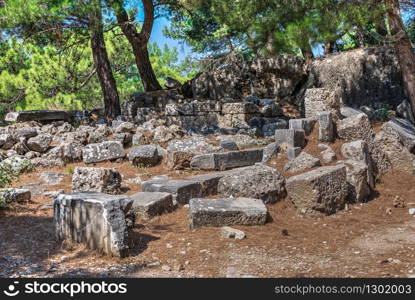 Ruins of the Ancient Theatre in the greek city of Priene in Turkey on a sunny summer day. Ancient Greek city Priene on the western coast of Turkey