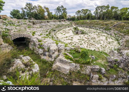 Ruins of the roman circus of syracuse inner passage steps and sand sicily italy