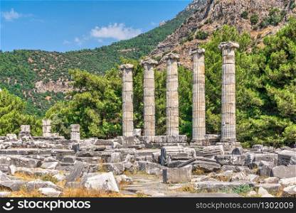 Ruins of the Temple of Athena Polias in the ancient city of Priene, Turkey, on a sunny summer day. The Temple of Athena Polias in the Ancient Priene, Turkey