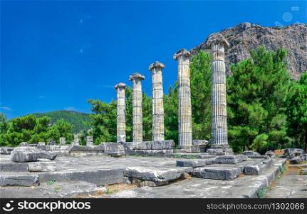 Ruins of the Temple of Athena Polias in the ancient city of Priene, Turkey, on a sunny summer day. Big panoramic shot.. The Temple of Athena Polias in the Ancient Priene, Turkey