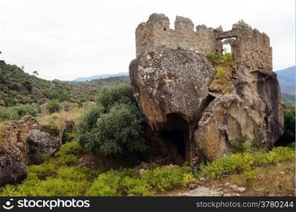Ruins on the boulder in Yediler monastery in Turkey