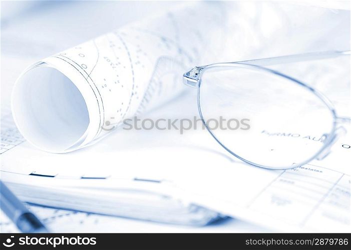 Ruler, eraser, glasses and a pencil on the floor plan - Bussines a still-life