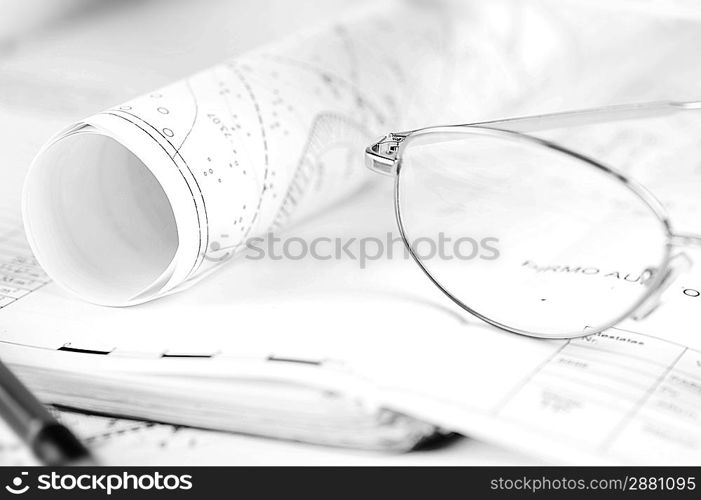 Ruler, eraser, glasses and a pencil on the floor plan - Bussines a still-life