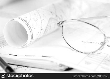 Ruler, eraser, glasses and a pencil on the floor plan - Bussines a still-life