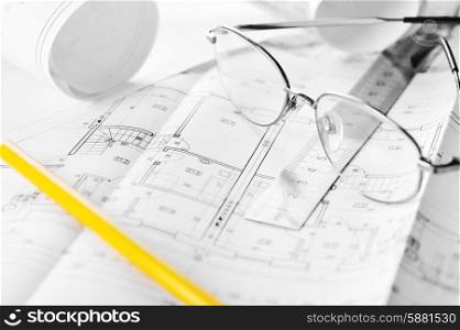 Ruler, eraser, glasses and a pencil on the floor plan - Bussines a still-life&#xA;