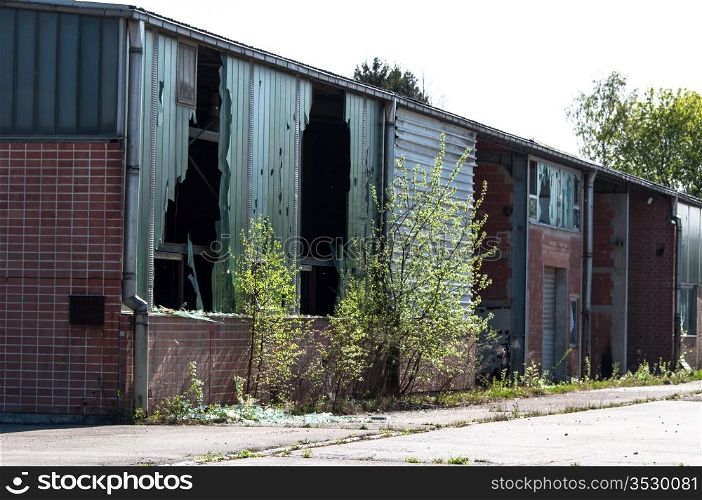 Rundown and abandoned factory with broken windows
