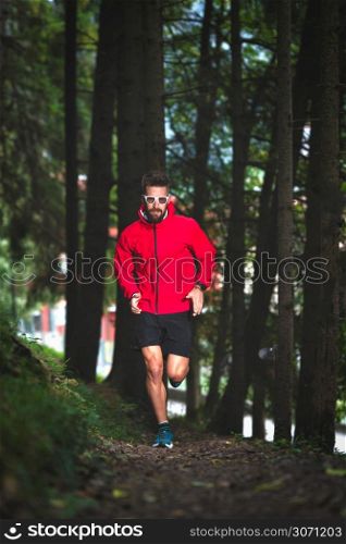 Runner in the woods on a nature trail