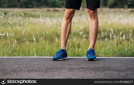 Runner man feet running on road closeup on shoe. Sports healthy lifestyle concept.