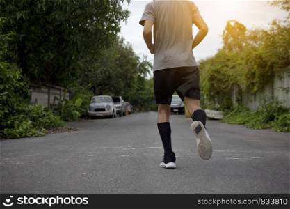 Runner Man run on the street be running for exercise,Run sports background and closeup at running shoe
