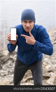 runner man showing blank phone nature