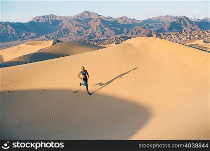 Runner sprinting in desert, Death Valley, California, USA