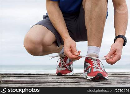 Runner tying shoelace