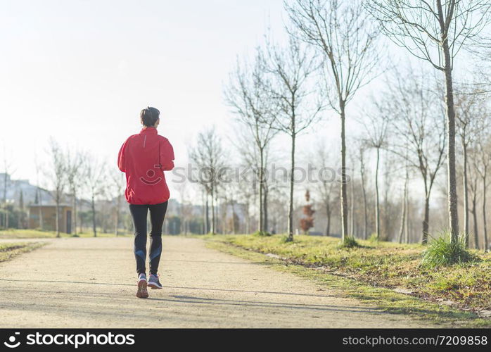 Runner woman jogging at the park