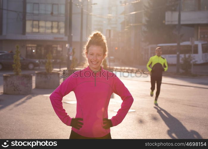 runner woman warming up and stretching before morning jogging