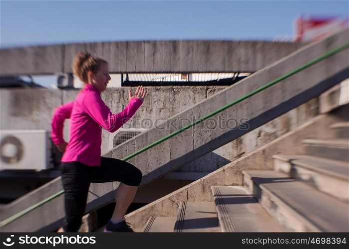runner woman warming up and stretching before morning jogging