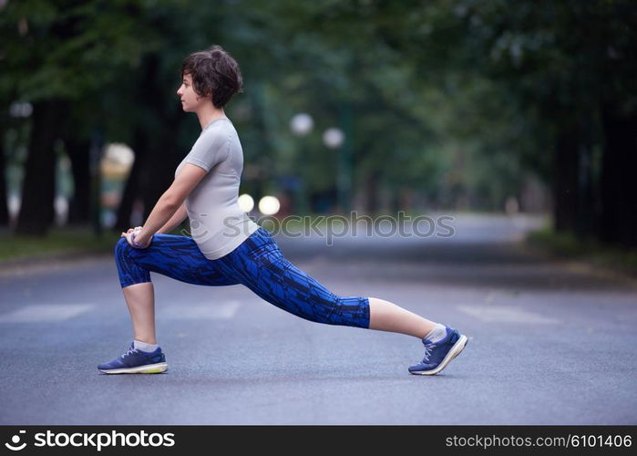 runner woman warming up and stretching before morning jogging