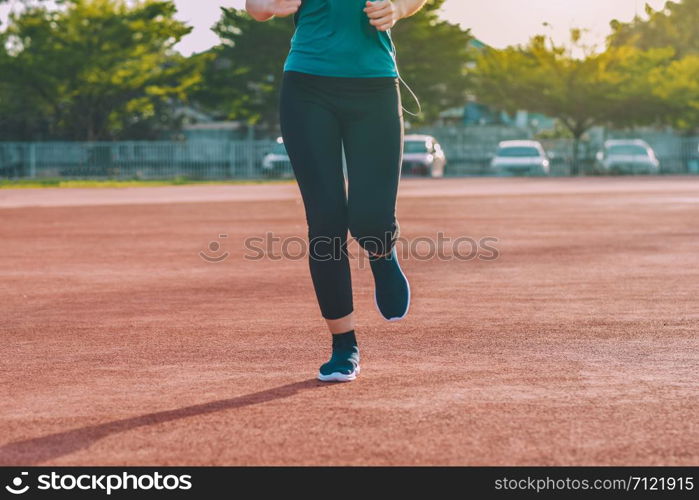 Runner Women jogging or running in evening at sunlight