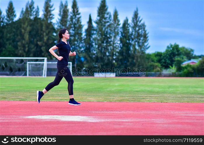 Runner Women jogging or running in evening at sunlight,Lady run jogging or exercise,Woman Runner or Girl Running
