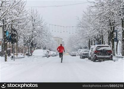 Running around town during a heavy snowfall