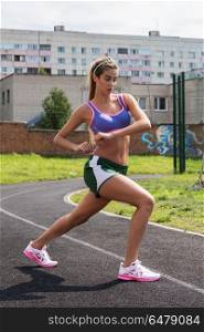 running at outdoor. A young beauty athletic woman in sportswear running at outdoor early morning. Healthy lifestyle.