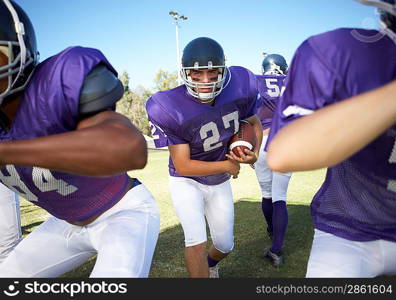 Running Back behind Linemen