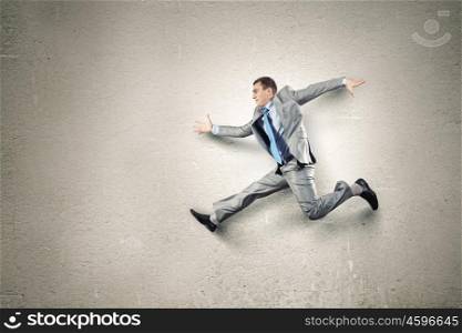 Running businessman. Funny image of businessman running in a hurry