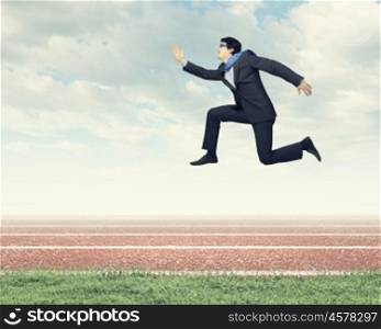 Running businessman. Funny image of running businessman at stadium. Competition concept