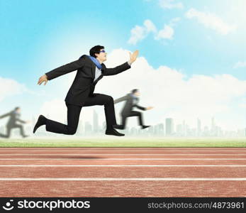 Running businessman. Funny image of running businessman at stadium. Competition concept