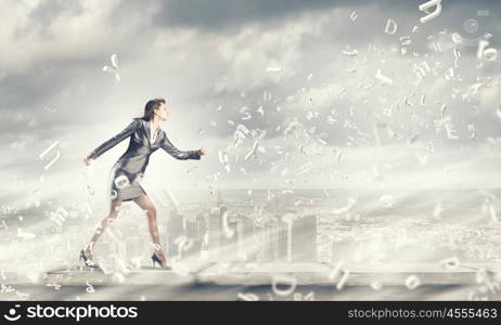 Running businesswoman. Young businesswoman in suit running in a hurry