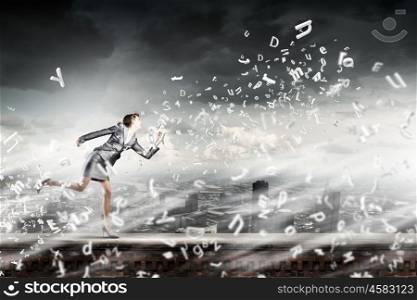 Running businesswoman. Young businesswoman in suit running in a hurry